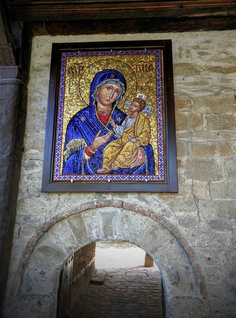 Roman-style mosaic of virgin Mary and baby Christ.